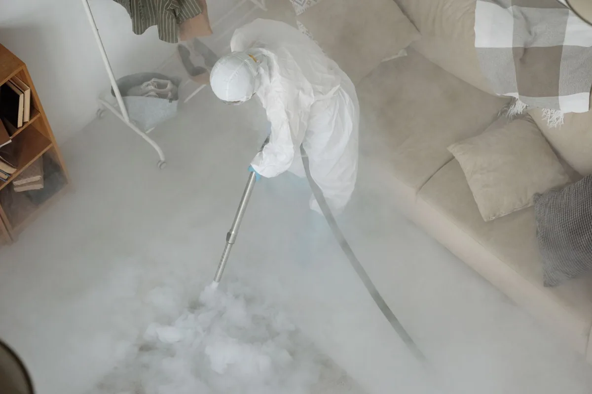 Biohazard cleanup technician in protective equipment, Sioux Center, IA